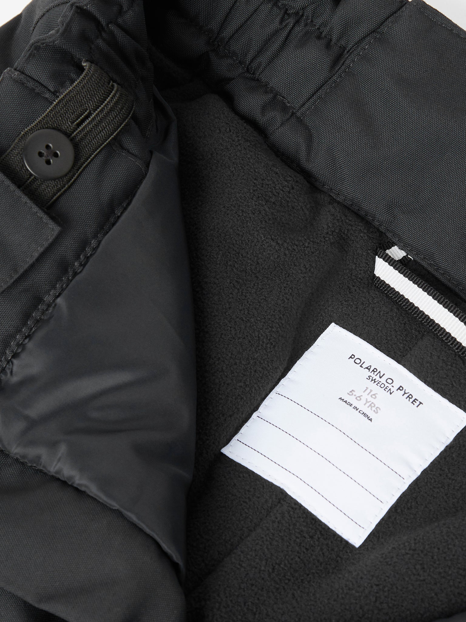 Kids Black Padded Waterproof Trousers from the Polarn O. Pyret outerwear collection. Made using ethically sourced materials.