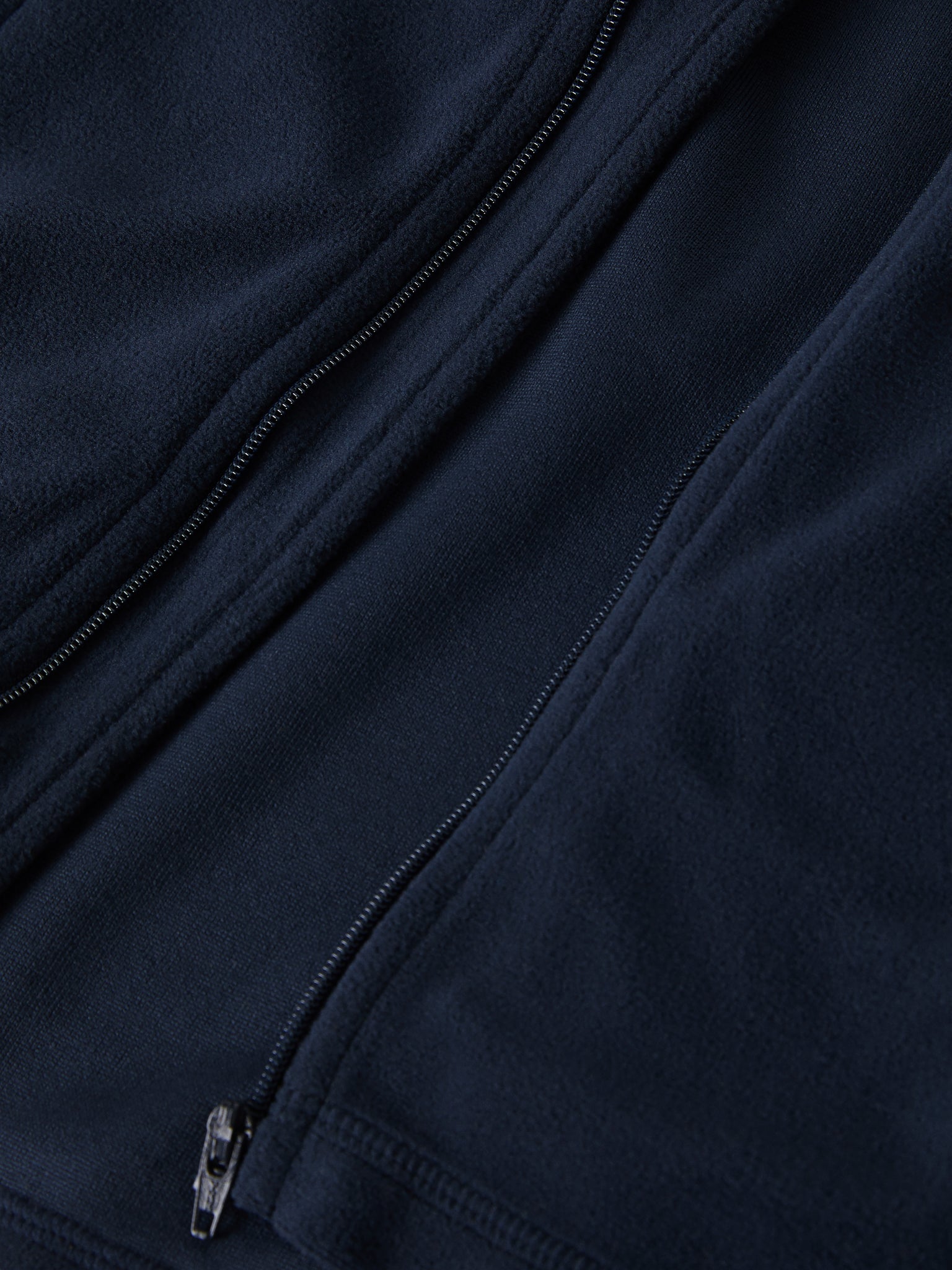 Navy Waterproof Kids Fleece Jacket from the Polarn O. Pyret outerwear collection. Ethically produced kids outerwear.