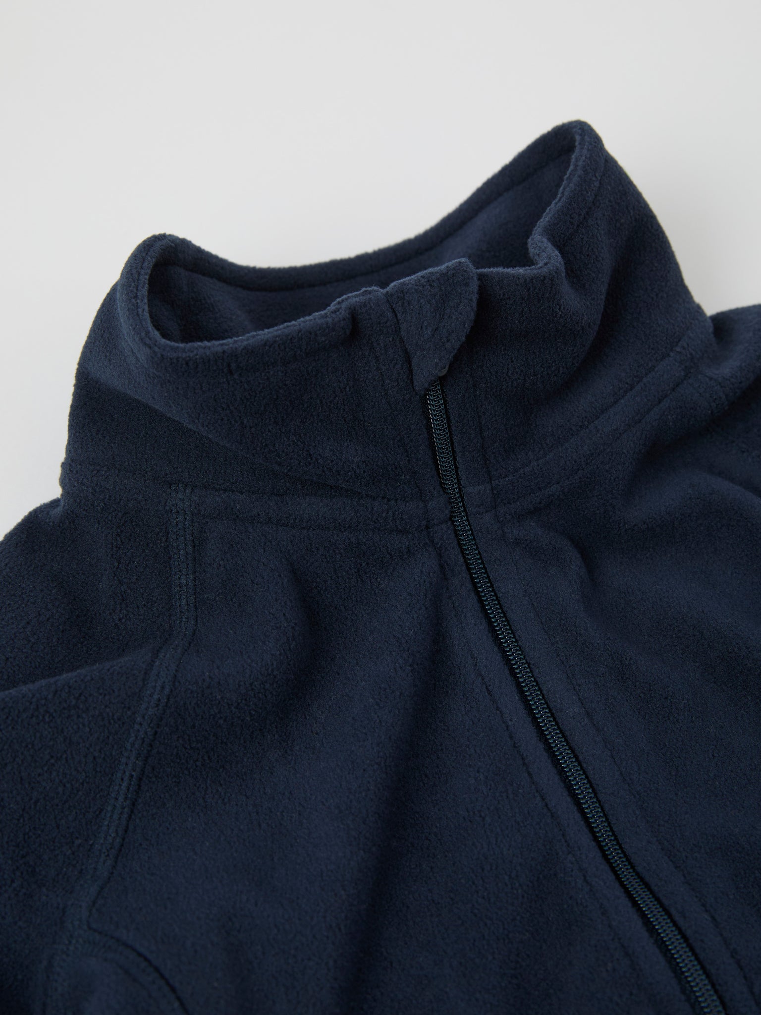 Navy Waterproof Kids Fleece Jacket from the Polarn O. Pyret outerwear collection. Ethically produced kids outerwear.