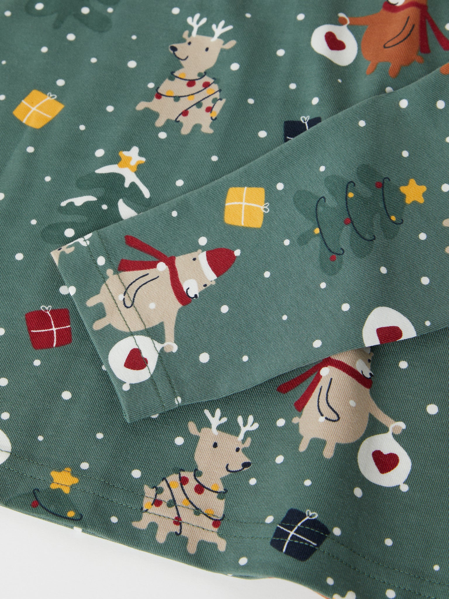 Christmas Print Cotton Adult Pyjamas from the Polarn O. Pyret adult collection. Clothes made using sustainably sourced materials.