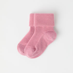 Pink Merino Baby Socks from the Polarn O. Pyret baby collection. Clothes made using sustainably sourced materials.