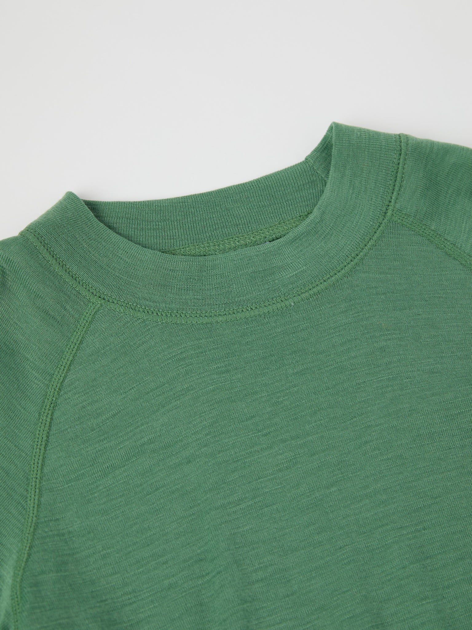 Green Thermal Merino Kids Top from the Polarn O. Pyret kidswear collection. Ethically produced kids outerwear.