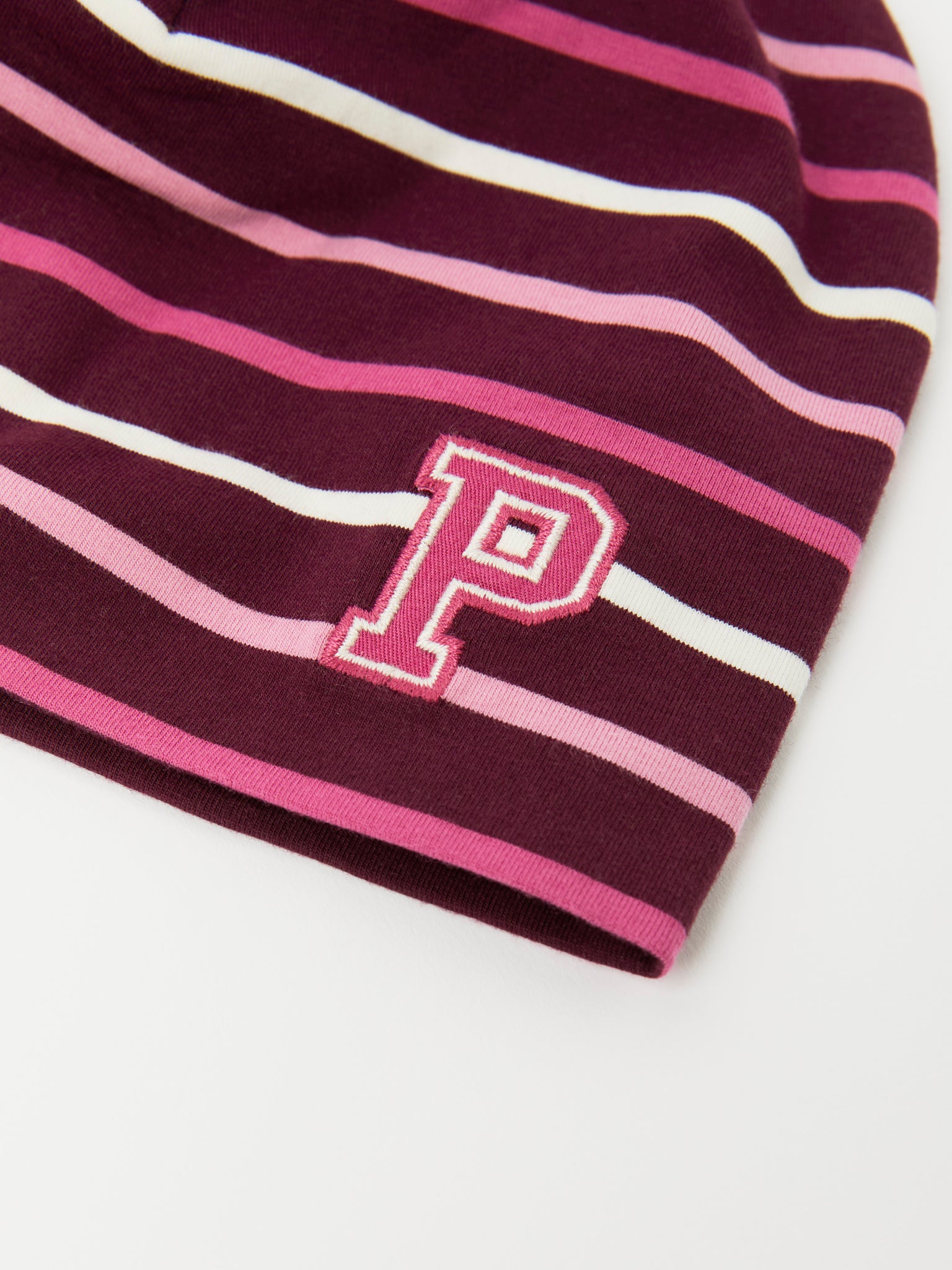 Burgundy Striped Kids Beanie Hat from the Polarn O. Pyret kidswear collection. Made using ethically sourced materials.