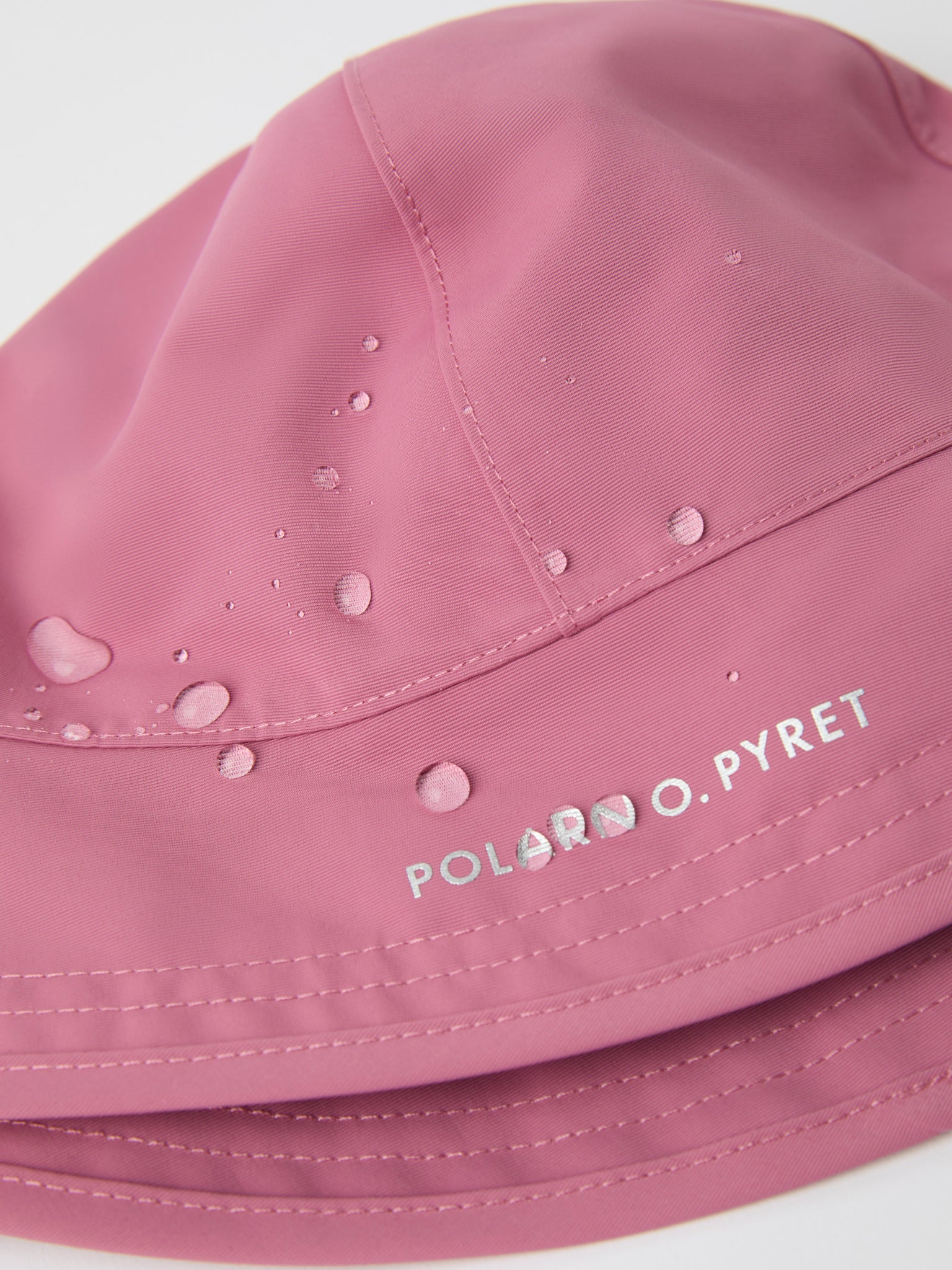 Pink Kids Waterproof Rain Hat from the Polarn O. Pyret kidswear collection. The best ethical kids outerwear.