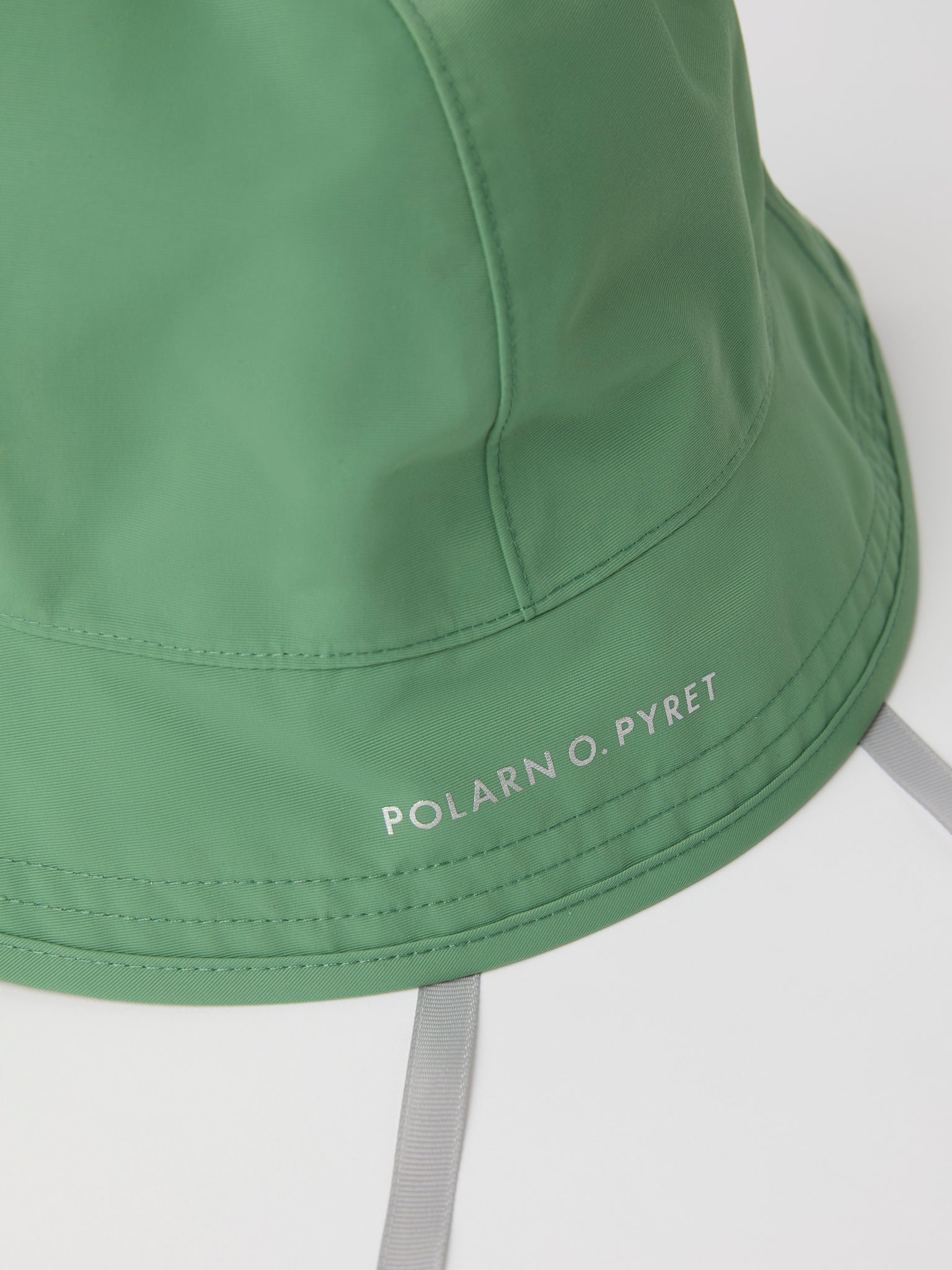 Green Kids Waterproof Rain Hat from the Polarn O. Pyret kidswear collection. Quality kids clothing made to last.