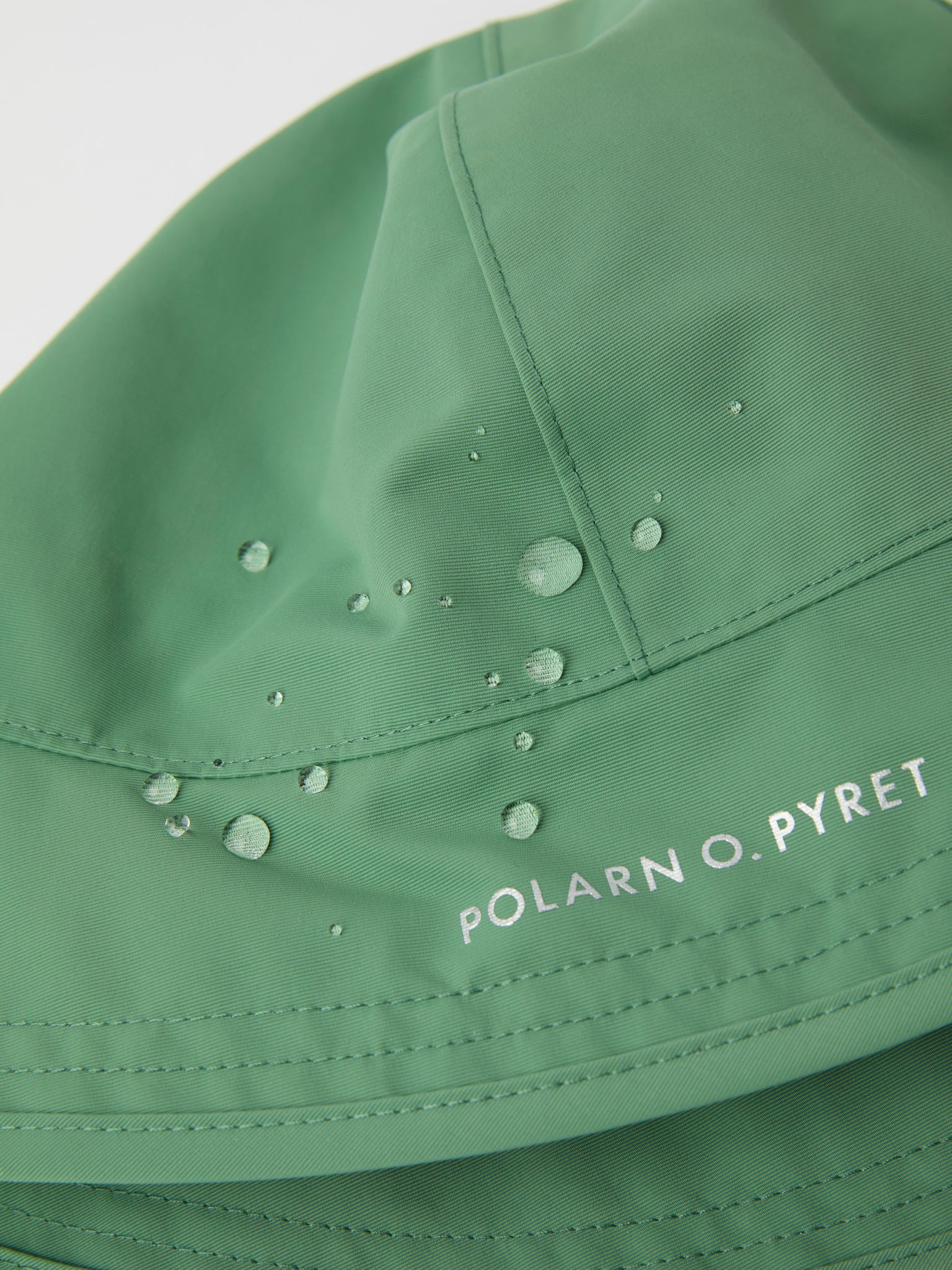 Green Kids Waterproof Rain Hat from the Polarn O. Pyret kidswear collection. Quality kids clothing made to last.