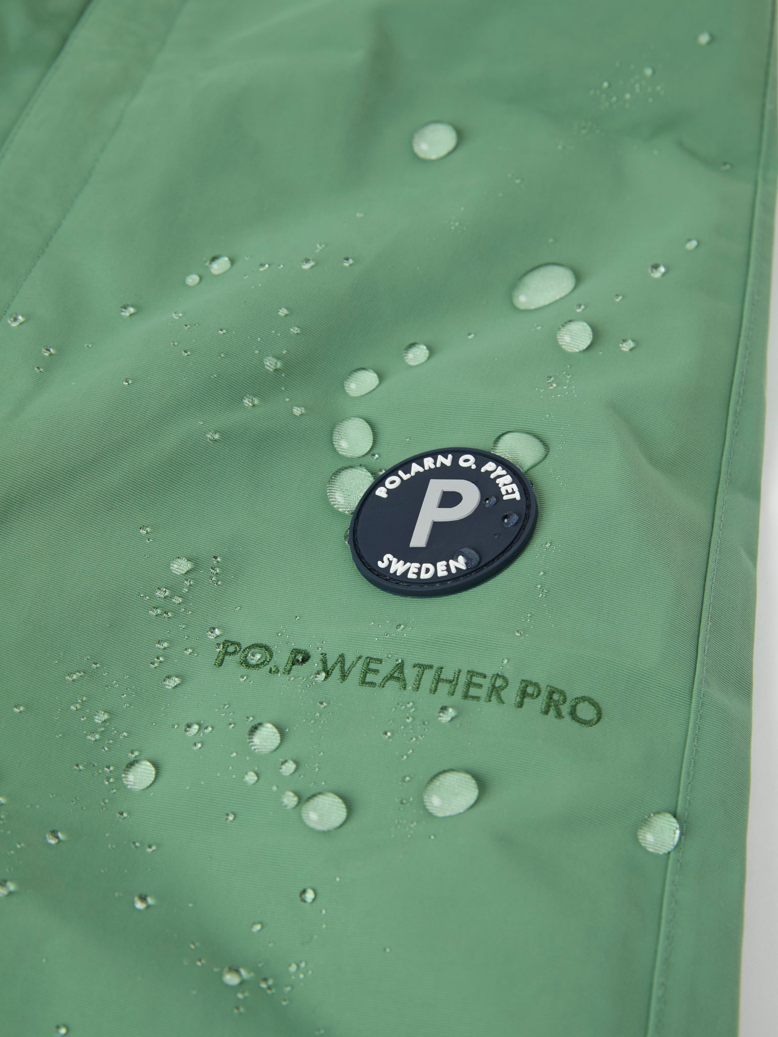 Green Waterproof Kids Shell Dungarees from the Polarn O. Pyret kidswear collection. The best ethical kids outerwear.