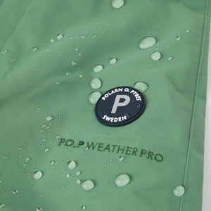 Green Waterproof Kids Shell Dungarees from the Polarn O. Pyret kidswear collection. The best ethical kids outerwear.