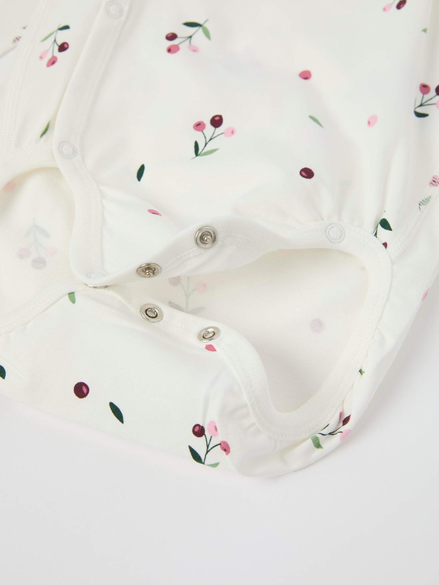 Floral Print Wraparound Babygrow from the Polarn O. Pyret baby collection. Clothes made using sustainably sourced materials.