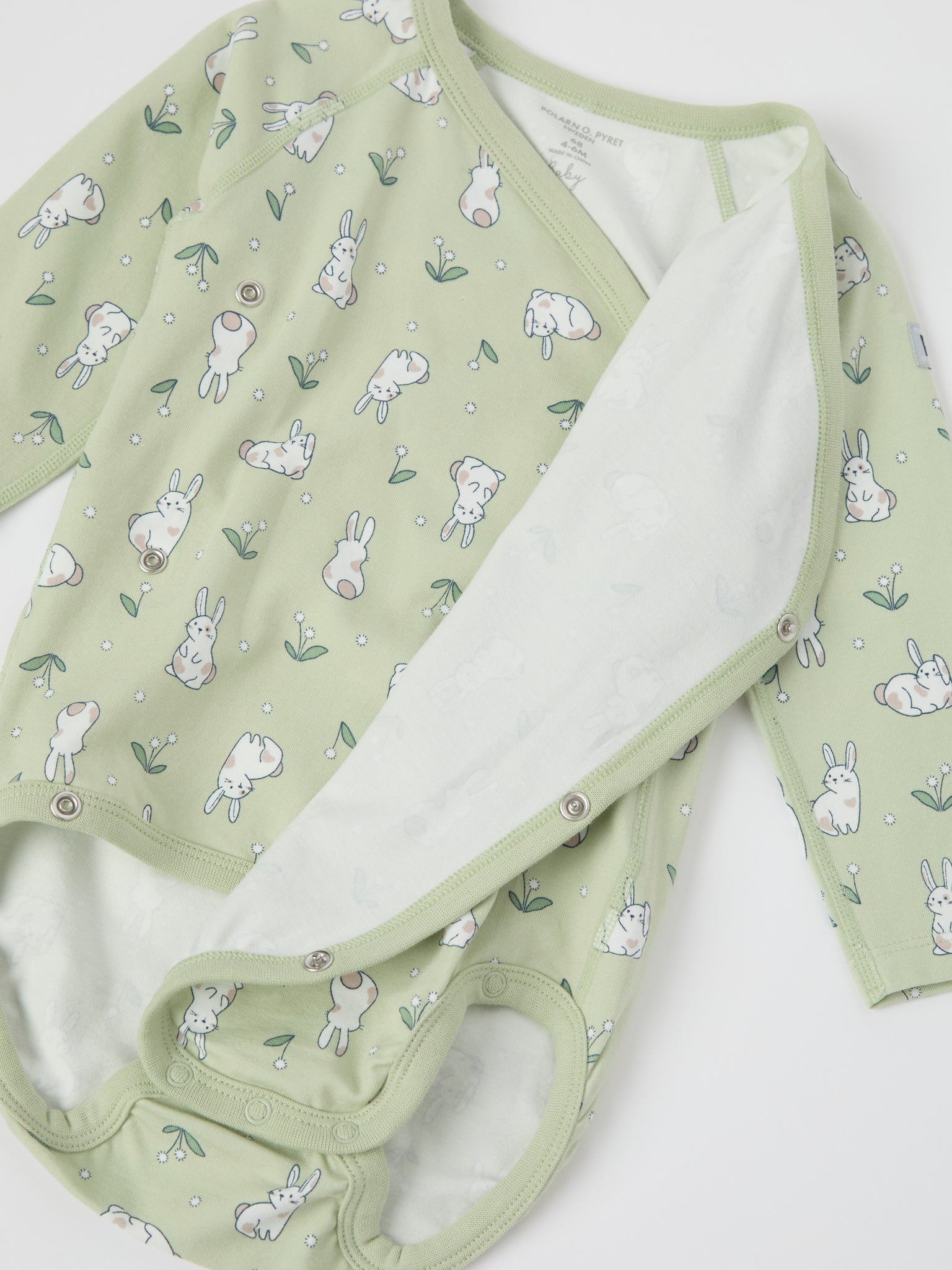 Bunny Print Wraparound Babygrow from the Polarn O. Pyret baby collection. Ethically produced kids clothing.