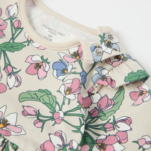 Apple Blossom Print Babygrow from the Polarn O. Pyret baby collection. Clothes made using sustainably sourced materials.