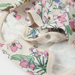 Apple Blossom Print Babygrow from the Polarn O. Pyret baby collection. Clothes made using sustainably sourced materials.