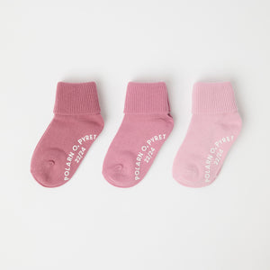 Three Pack Pink Antislip Kids Socks from Polarn O. Pyret kidswear. Clothes made using sustainably sourced materials.