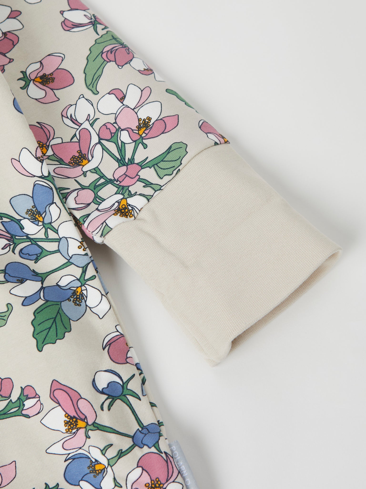 Apple blossom Print Baby All-in-one from the Polarn O. Pyret baby collection. Clothes made using sustainably sourced materials.