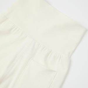 White Cotton Baby Leggings from the Polarn O. Pyret baby collection. Ethically produced kids clothing.