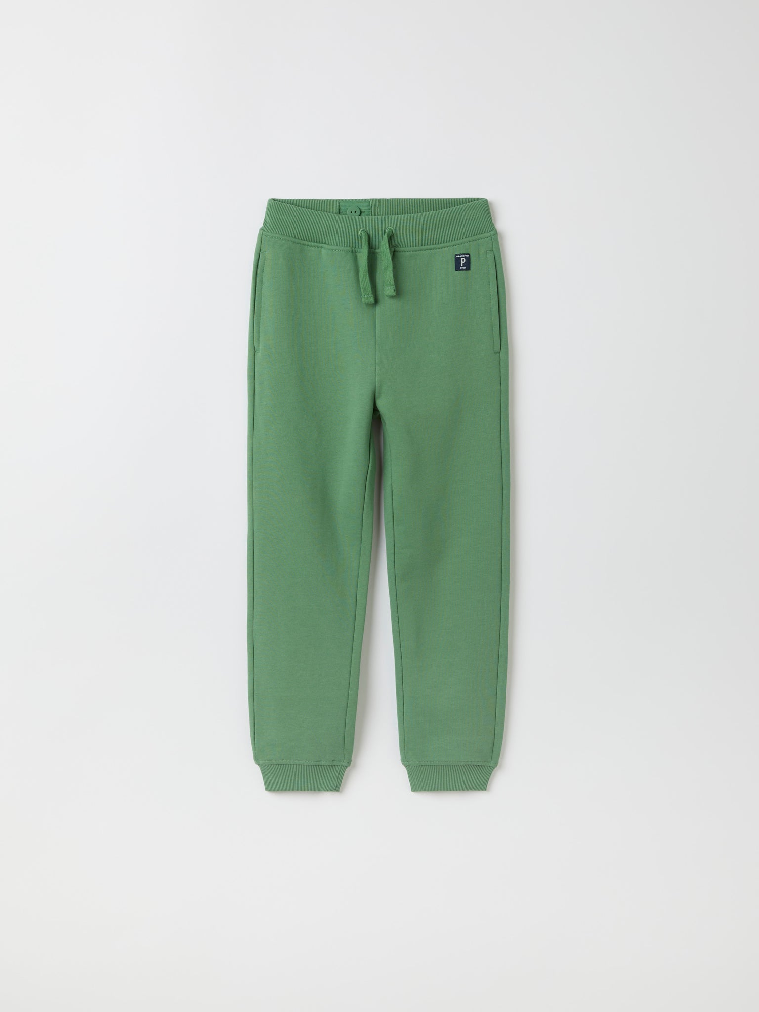 Green Organic Kids Joggers from Polarn O. Pyret kidswear. Clothes made using sustainably sourced materials.