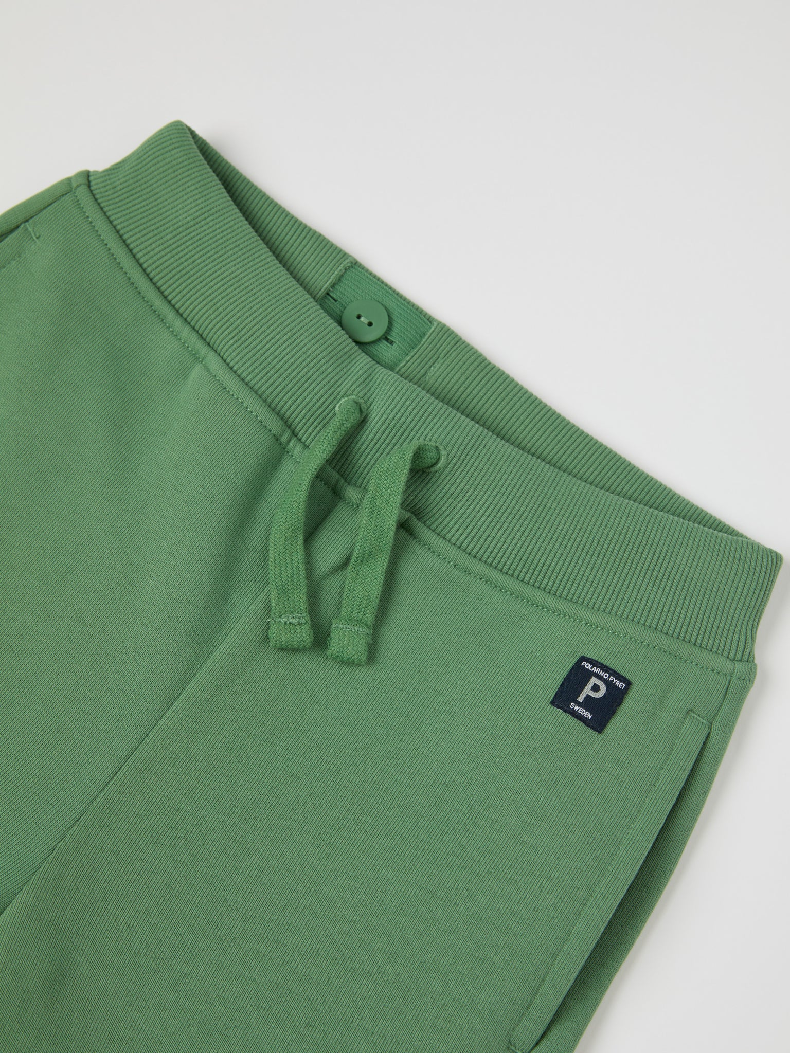 Green Organic Kids Joggers from Polarn O. Pyret kidswear. Clothes made using sustainably sourced materials.