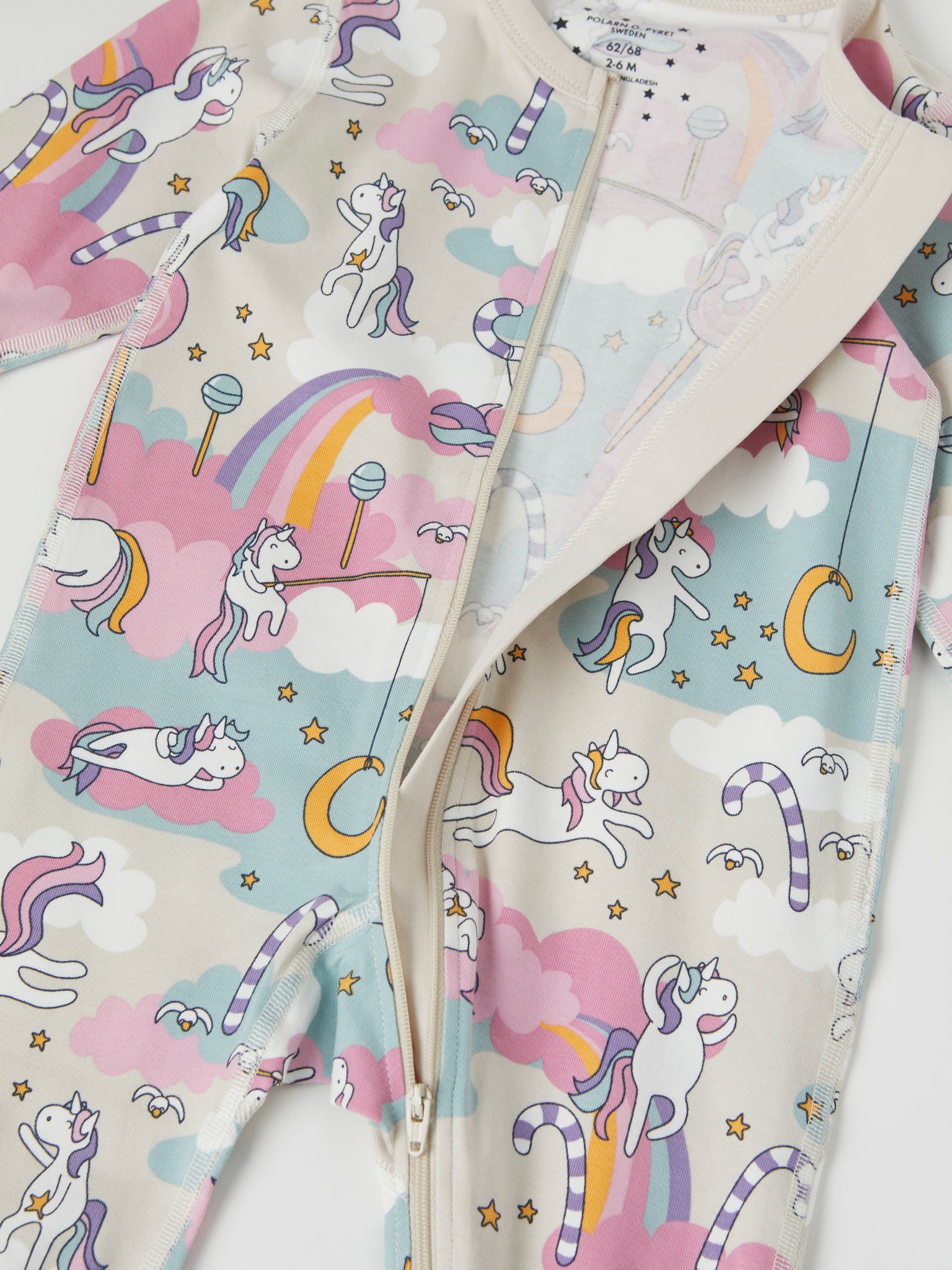 Unicorn Print Cotton Baby Sleepsuit from the Polarn O. Pyret baby collection. Clothes made using sustainably sourced materials.