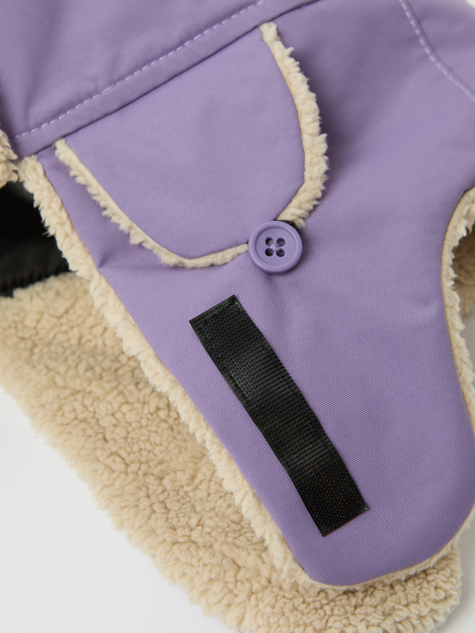 Purple Kids Fur Trim Hat from the Polarn O. Pyret kidswear collection. Ethically produced kids outerwear.