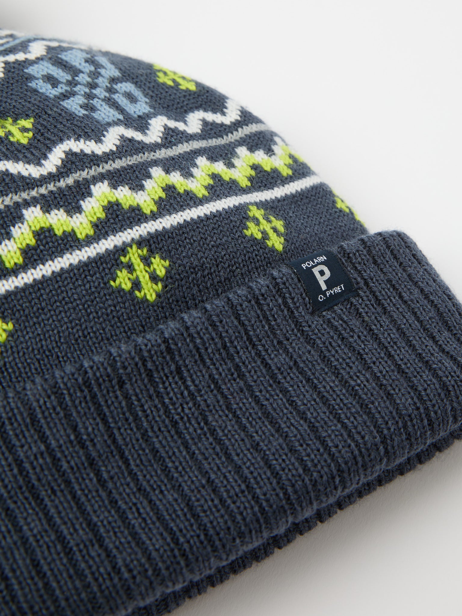 Blue Kids Nordic Bobble Hat from the Polarn O. Pyret kidswear collection. The best ethical kids outerwear.