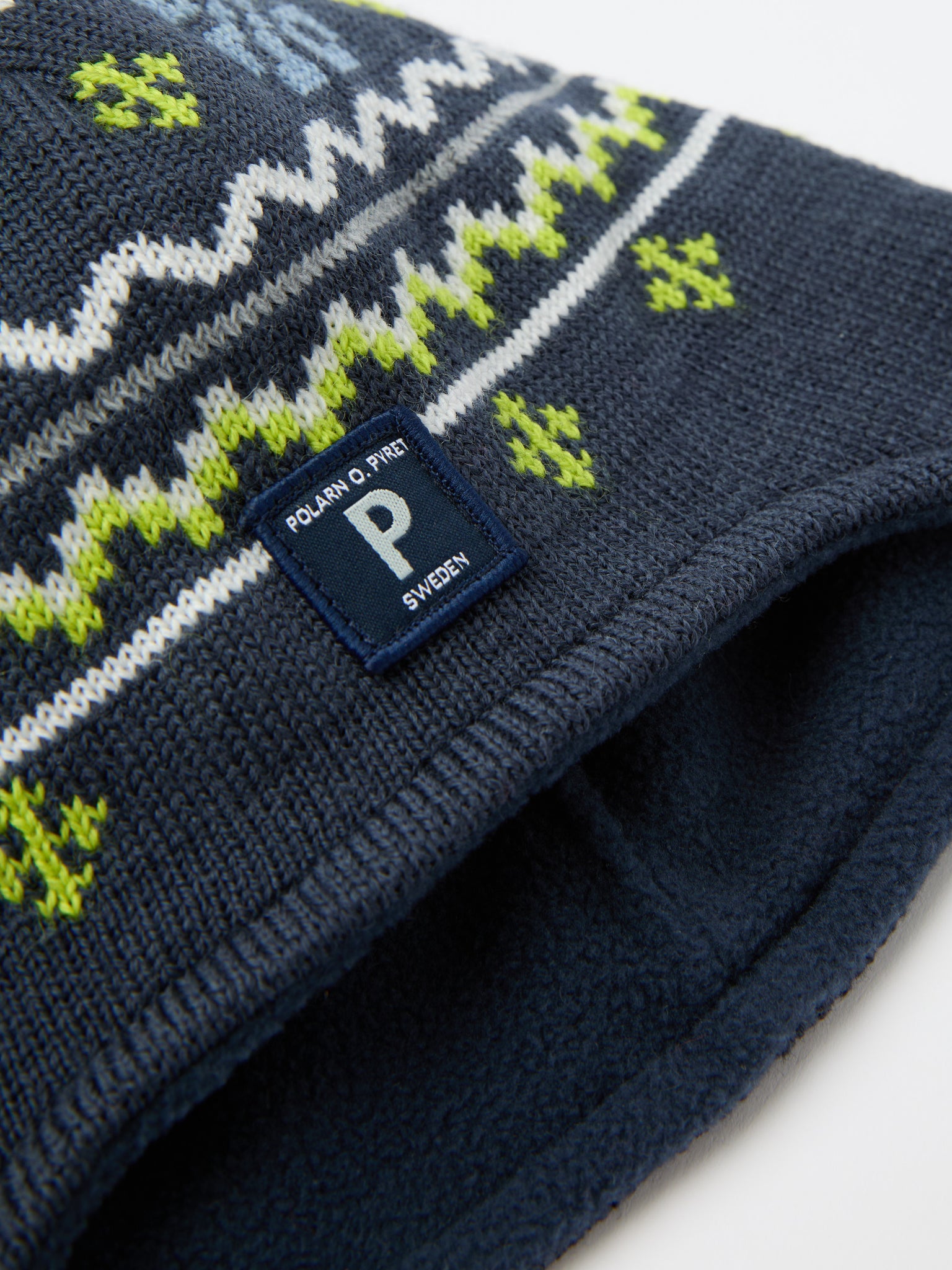 Blue Merino Wool Kids Bobble Hat from the Polarn O. Pyret kidswear collection. Made using ethically sourced materials.