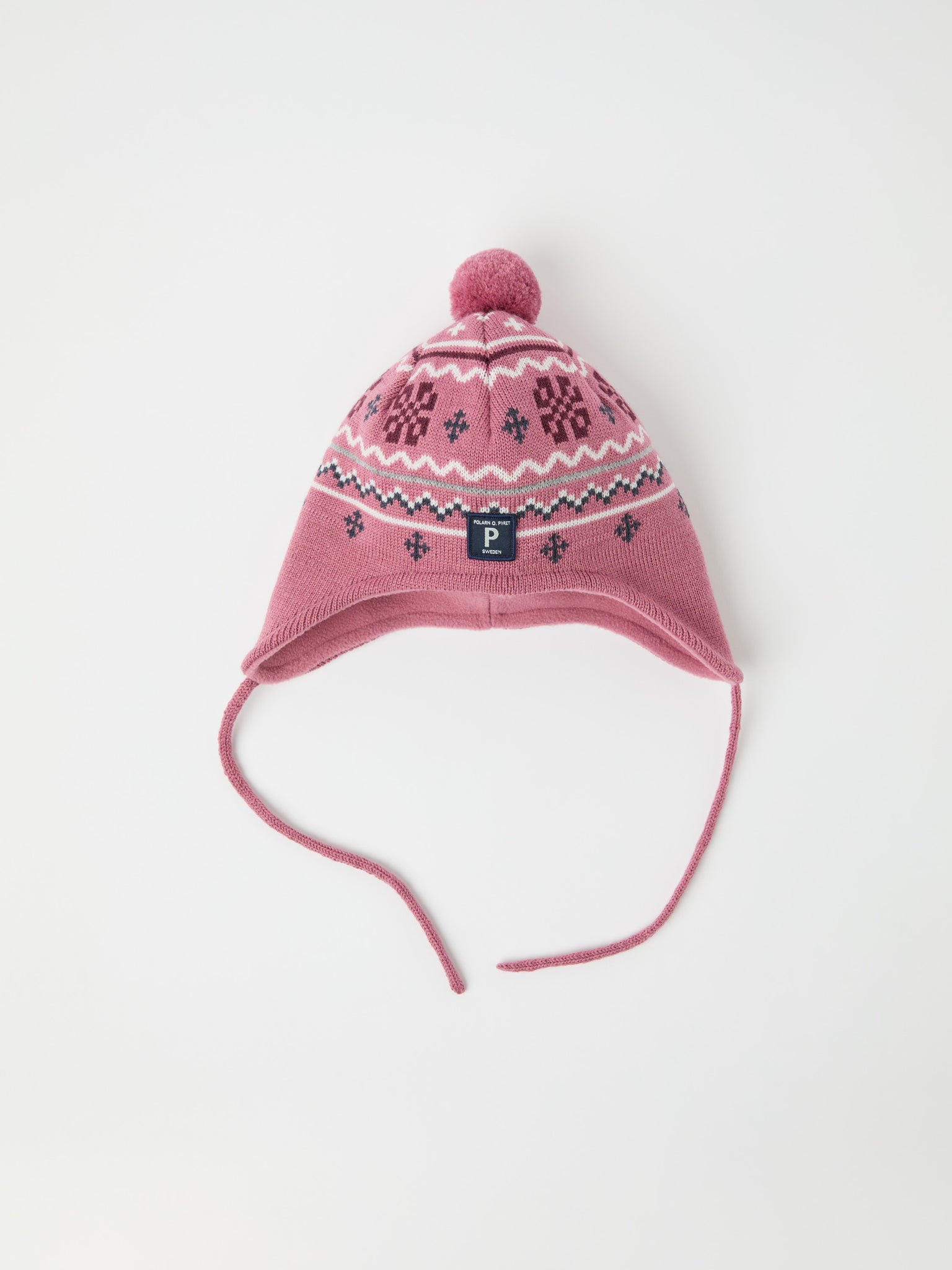 Pink Merino Wool Kids Bobble Hat from the Polarn O. Pyret kidswear collection. Ethically produced kids outerwear.