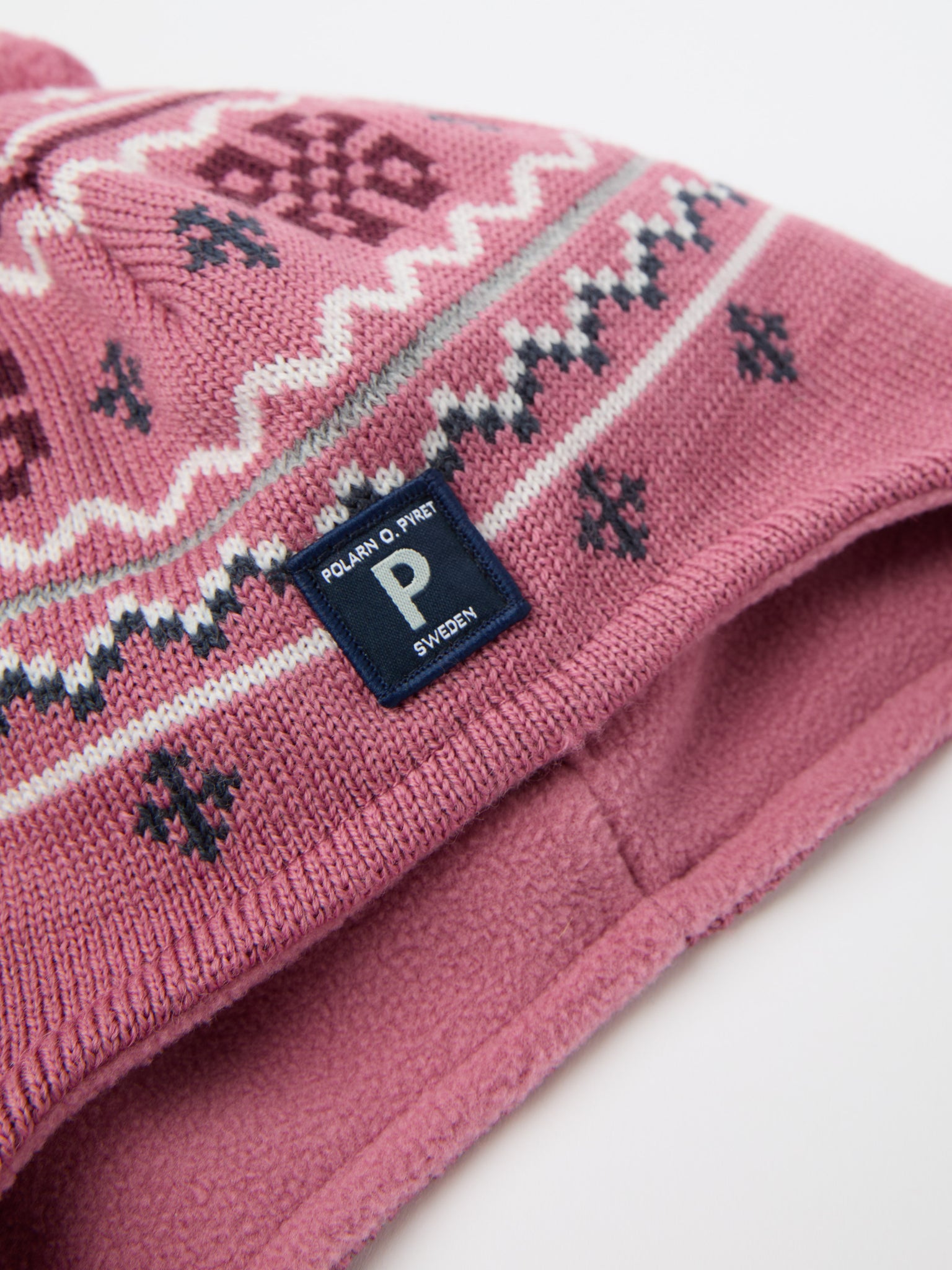 Pink Merino Wool Kids Bobble Hat from the Polarn O. Pyret kidswear collection. Ethically produced kids outerwear.