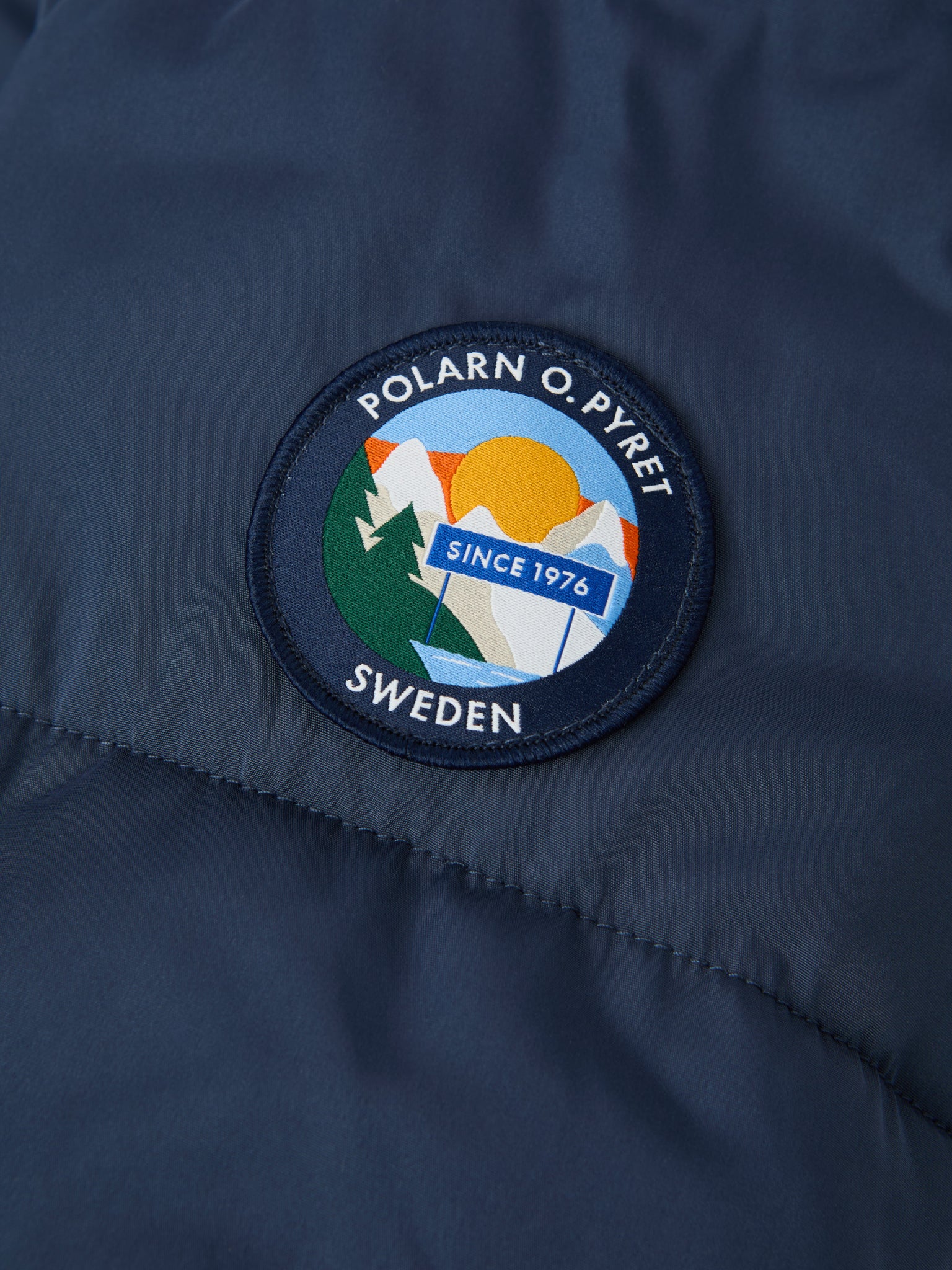 Navy Padded Water Resistant Kids Coat from the Polarn O. Pyret kidswear collection. The best ethical kids outerwear.