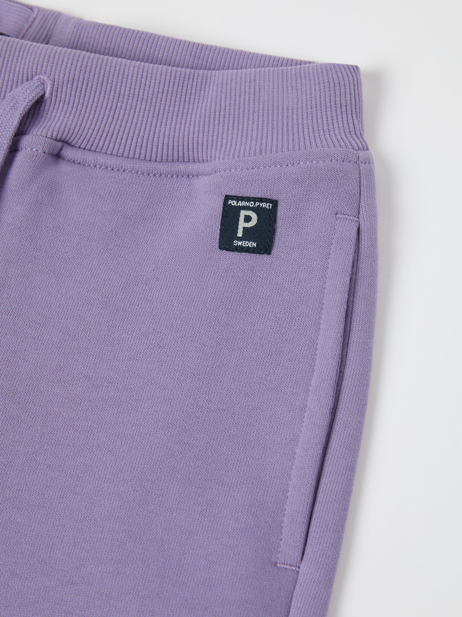 Purple Organic Cotton Kids Joggers from the Polarn O. Pyret kidswear collection. Nordic kids clothes made from sustainable sources.