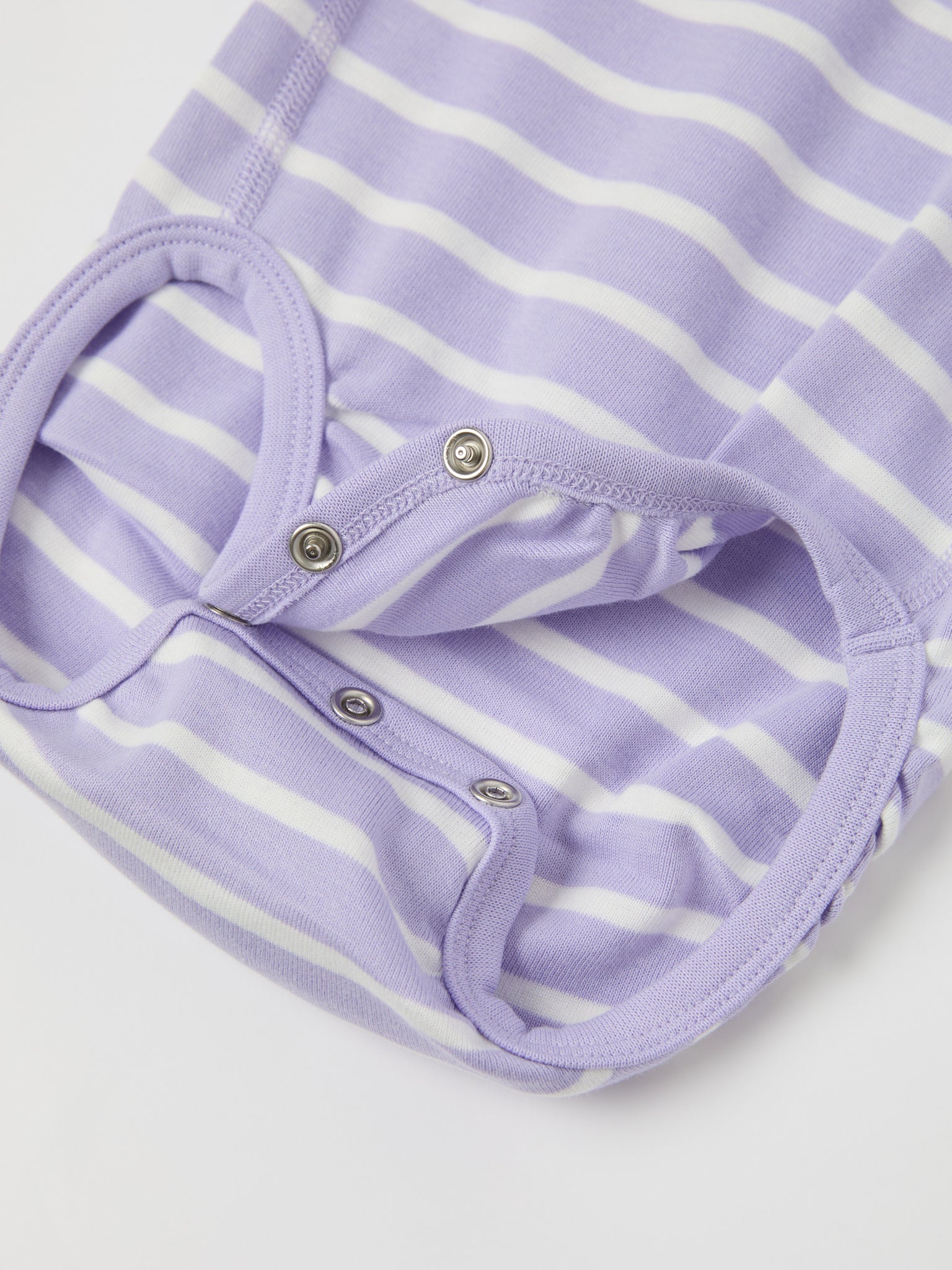 Purple Striped Babygrow from the Polarn O. Pyret baby collection. Clothes made using sustainably sourced materials.