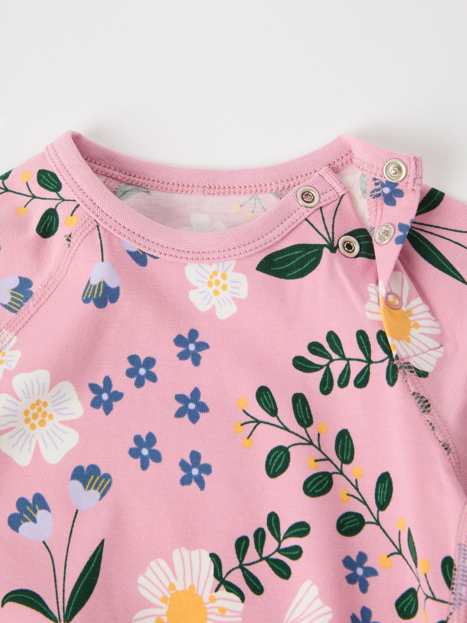 Floral Print Organic Babygrow from the Polarn O. Pyret baby collection. Clothes made using sustainably sourced materials.