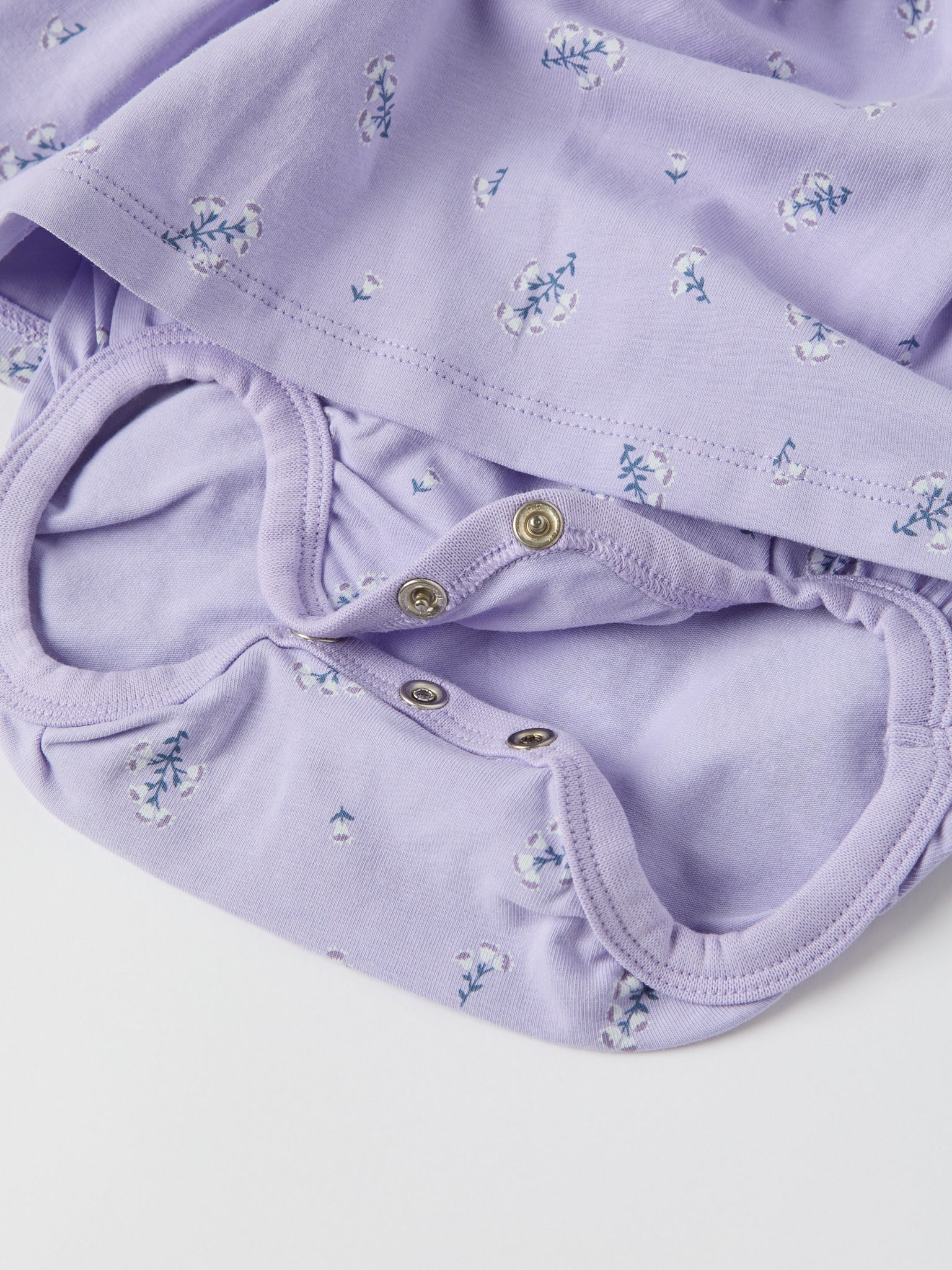 Purple Floral Print Babygrow Dress from the Polarn O. Pyret baby collection. Ethically produced kids clothing.