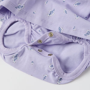 Purple Floral Print Babygrow Dress from the Polarn O. Pyret baby collection. Ethically produced kids clothing.