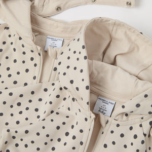 Polka Dot Print Organic Baby All-in-one from the Polarn O. Pyret baby collection. Nordic kids clothes made from sustainable sources.