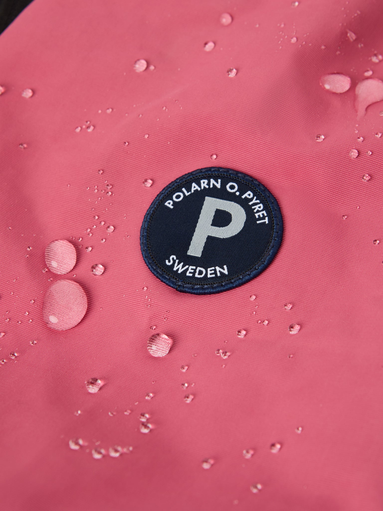 Pink Recycled Kids Puddle Suit from the Polarn O. Pyret kidswear collection. Ethically produced kids outerwear.