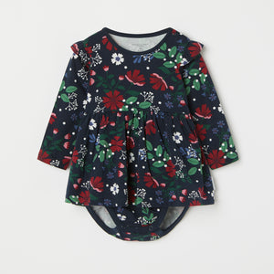 Floral Print Babygrow Dress from the Polarn O. Pyret baby collection. Clothes made using sustainably sourced materials.