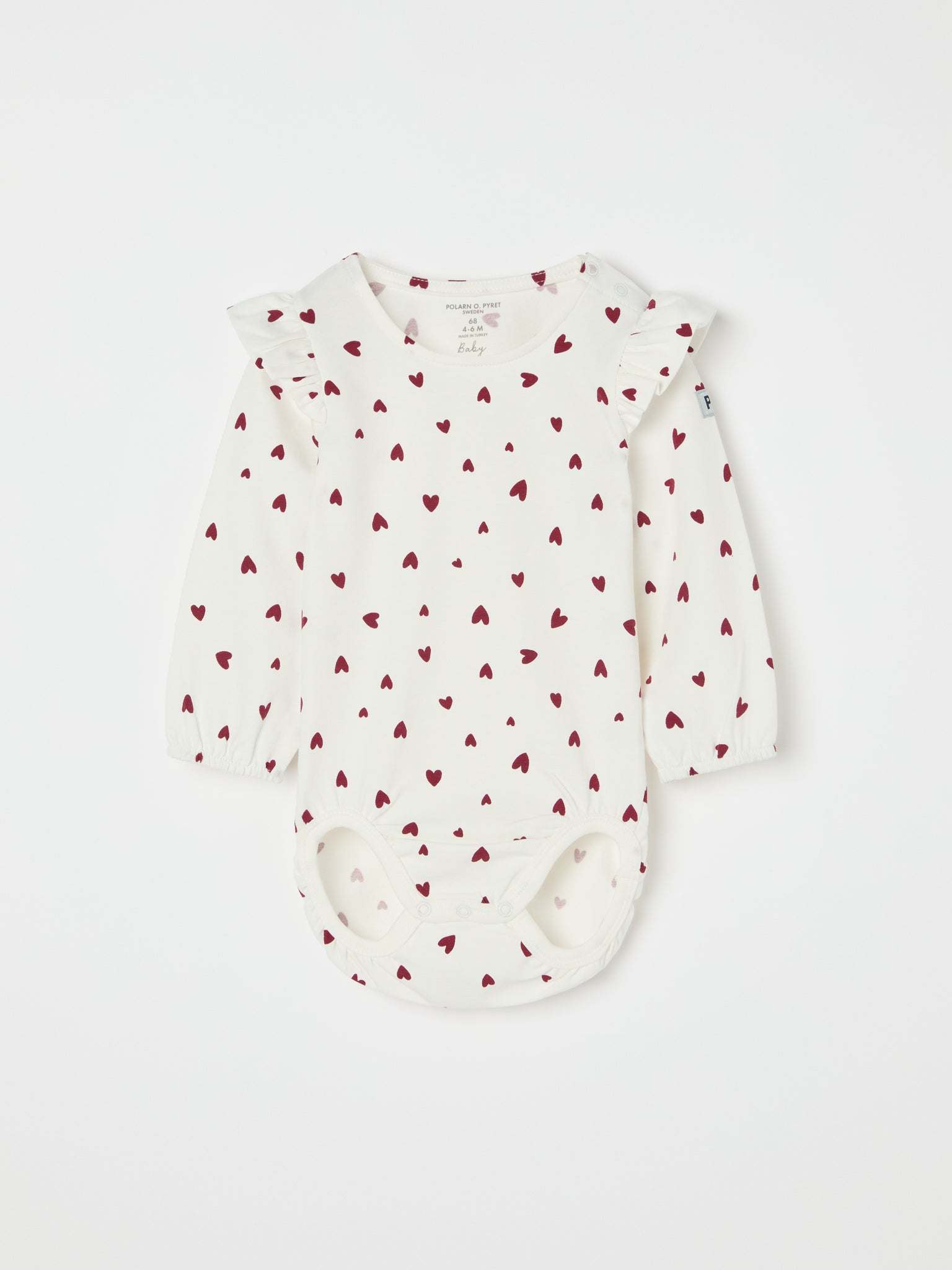 Organic Cotton Heart Print Babygrow from the Polarn O. Pyret baby collection. Ethically produced kids clothing.