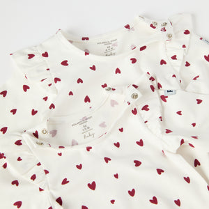 Organic Cotton Heart Print Babygrow from the Polarn O. Pyret baby collection. Ethically produced kids clothing.