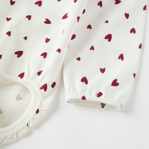 Organic Cotton Heart Print Babygrow from the Polarn O. Pyret baby collection. Ethically produced kids clothing.