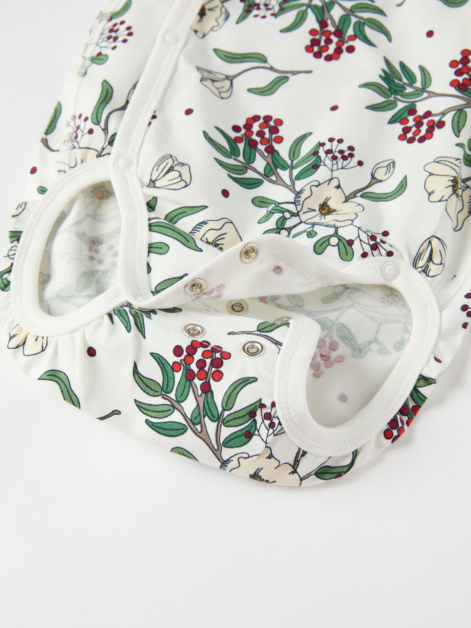 Floral Print Wraparound Babygrow from the Polarn O. Pyret baby collection. Clothes made using sustainably sourced materials.