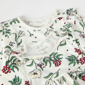 Organic Cotton Floral Print Baby Dress from the Polarn O. Pyret baby collection. Nordic kids clothes made from sustainable sources.