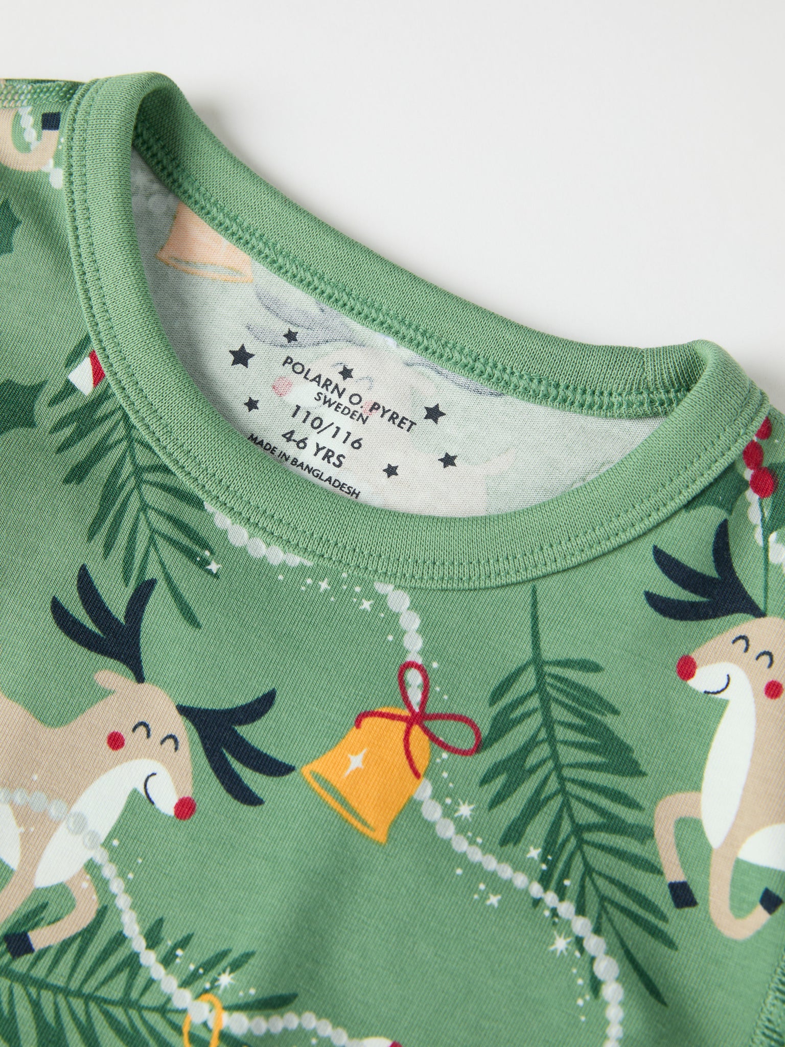 Reindeer Print Kids Pyjamas from the Polarn O. Pyret kidswear collection. Clothes made using sustainably sourced materials.