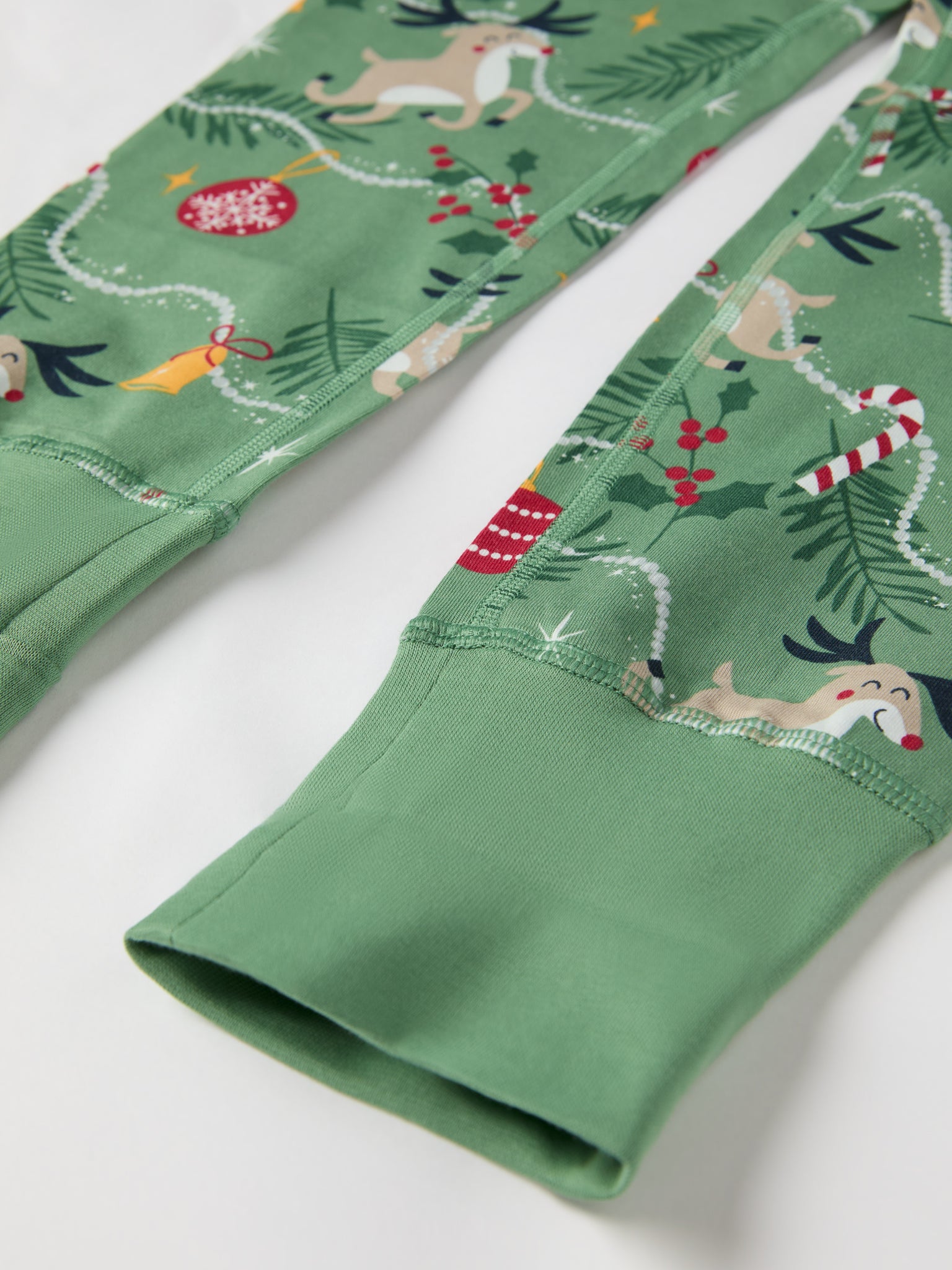 Reindeer Print Kids Pyjamas from the Polarn O. Pyret kidswear collection. Clothes made using sustainably sourced materials.