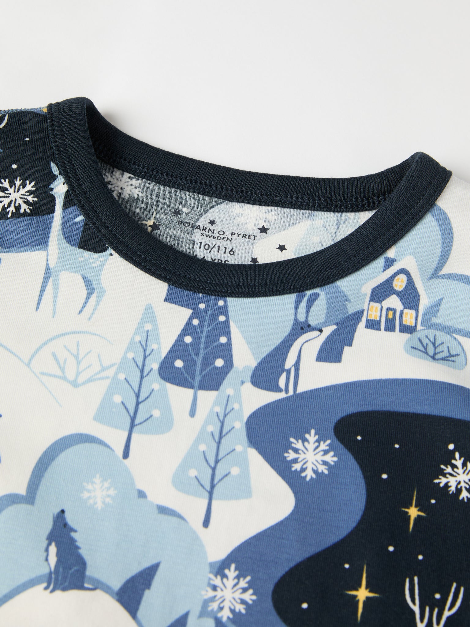 Winter Forest Print Kids Pyjamas from the Polarn O. Pyret kidswear collection. Clothes made using sustainably sourced materials.