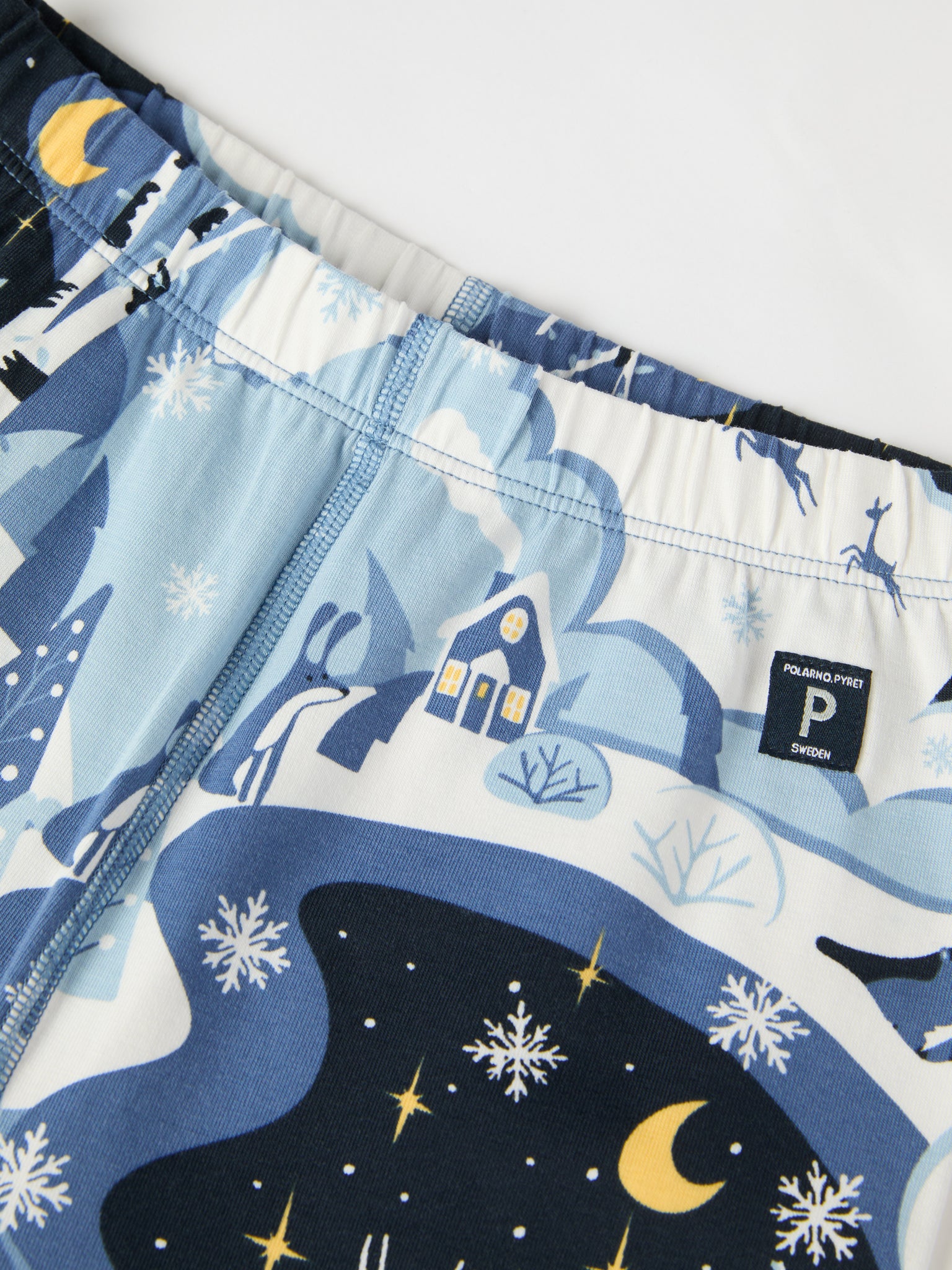 Winter Forest Print Kids Pyjamas from the Polarn O. Pyret kidswear collection. Clothes made using sustainably sourced materials.