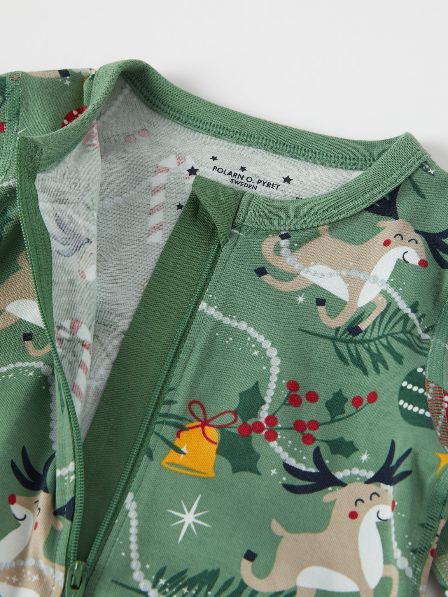 Reindeer Print Baby Sleepsuit from the Polarn O. Pyret baby collection. Nordic kids clothes made from sustainable sources.