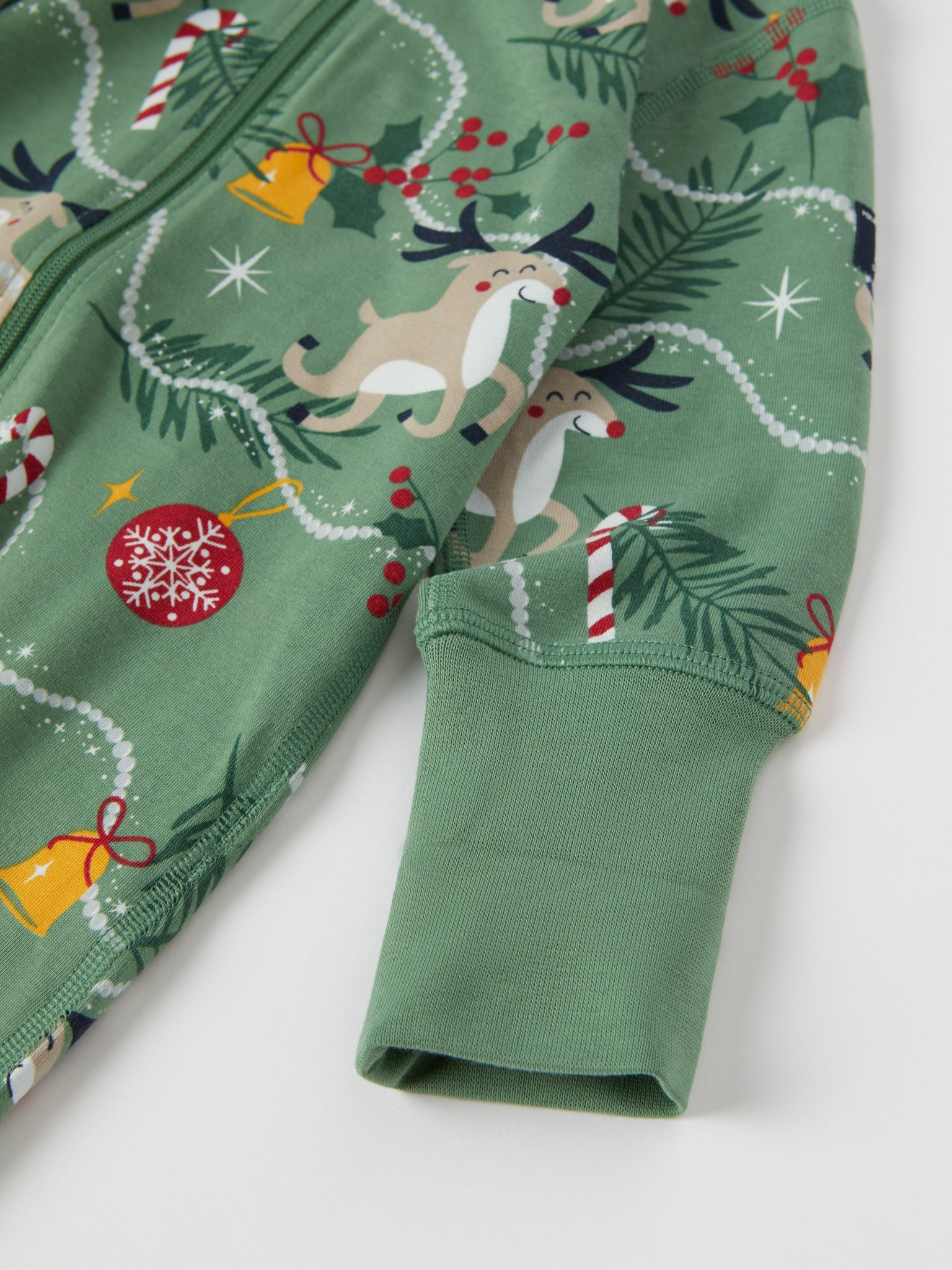 Reindeer Print Baby Sleepsuit from the Polarn O. Pyret baby collection. Nordic kids clothes made from sustainable sources.