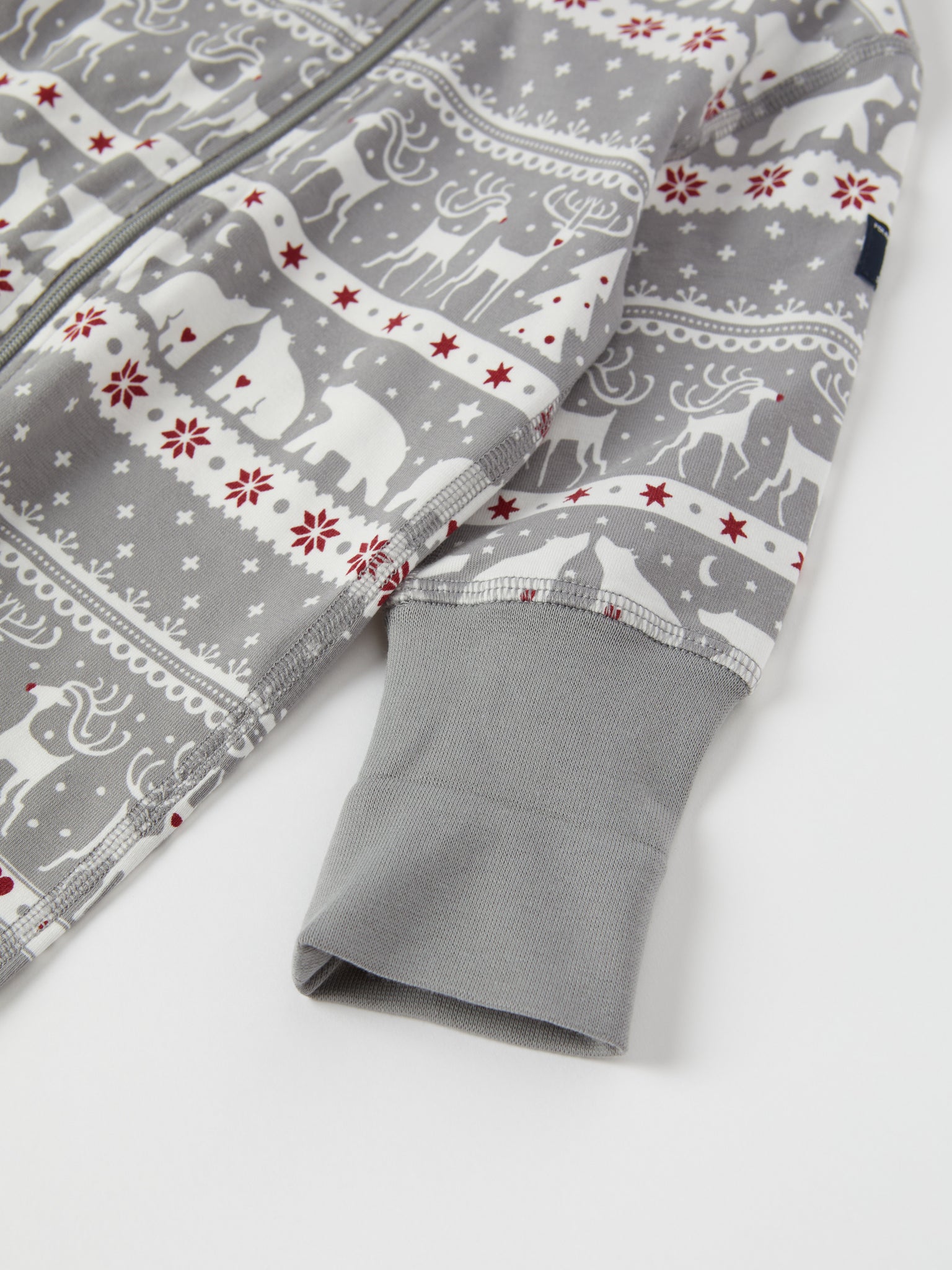 Nordic Christmas Print Baby Sleepsuit from the Polarn O. Pyret baby collection. Ethically produced kids clothing.