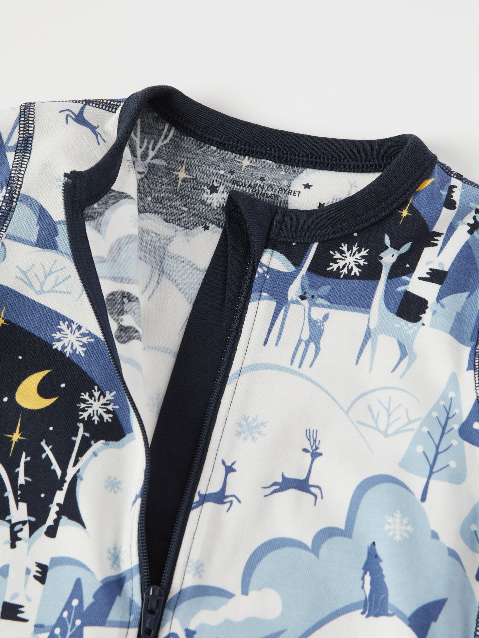 Winter Forest Print Baby Sleepsuit from the Polarn O. Pyret baby collection. Nordic kids clothes made from sustainable sources.