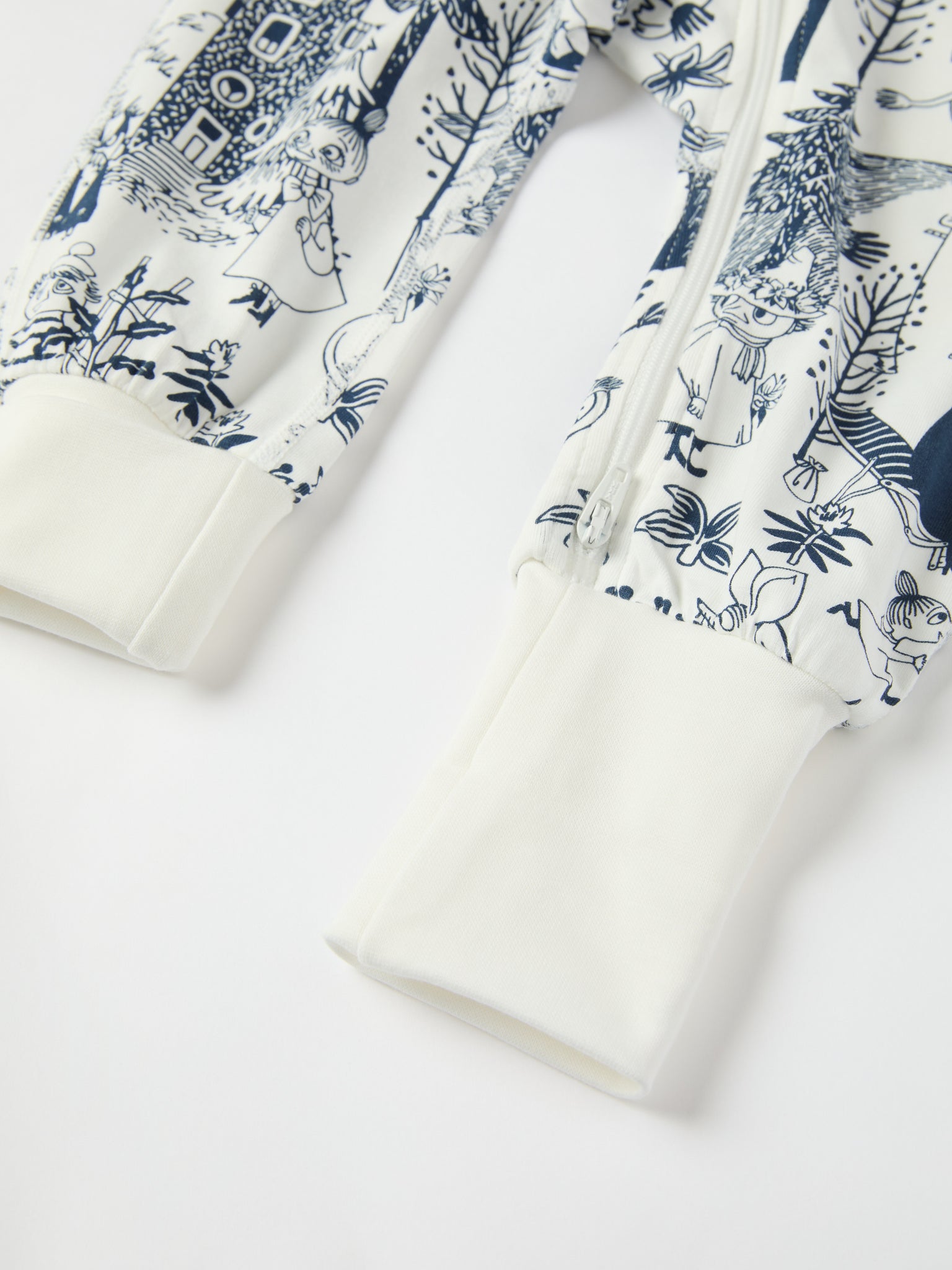 Moomin Print Cotton Baby Sleepsuit from the Polarn O. Pyret baby collection. Clothes made using sustainably sourced materials.